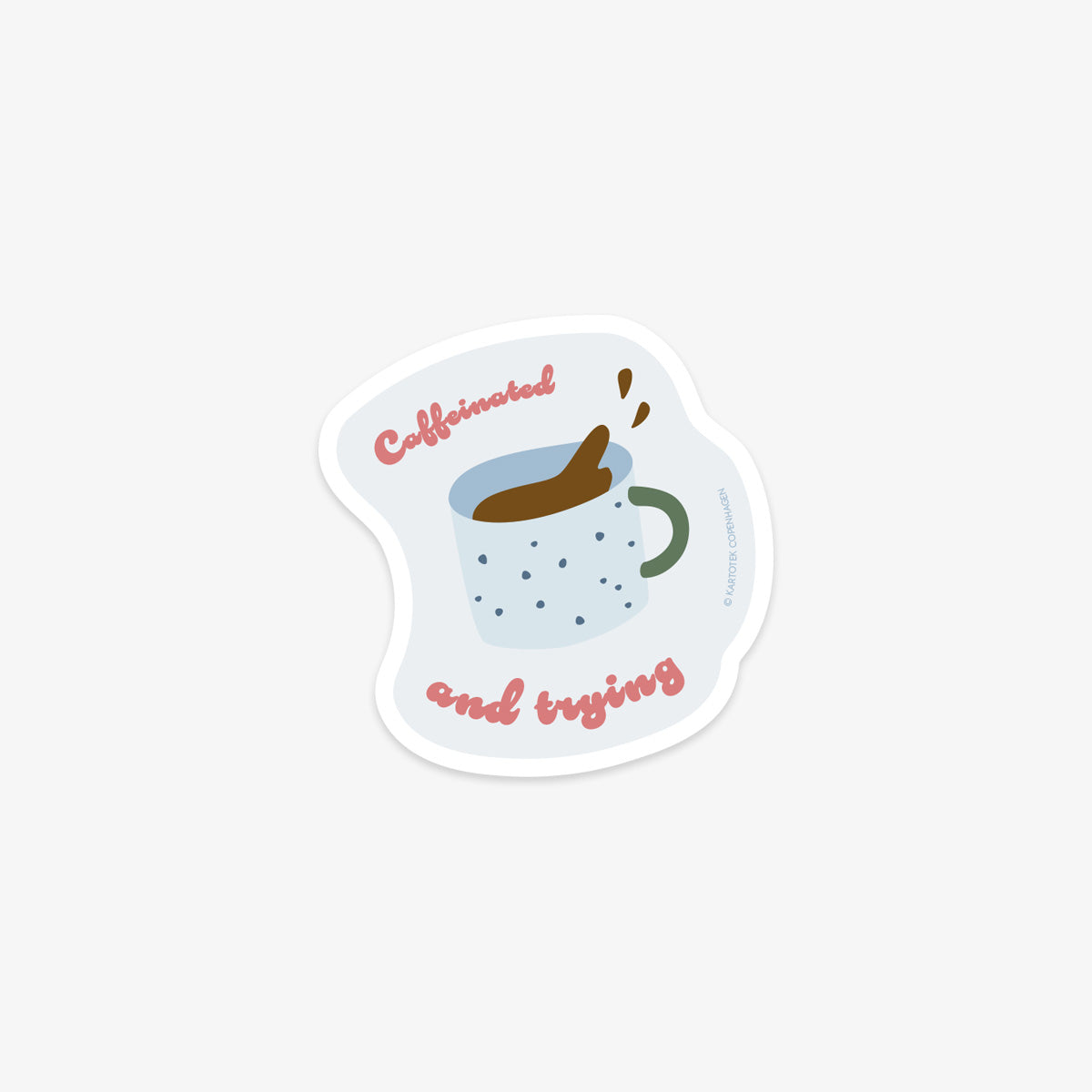 Vinyl sticker with a coffee cup design and text 'Caffeinated and trying' on a white background
