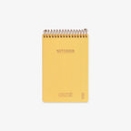 Yellow notebook with spiral binding on a white background