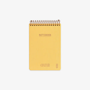 Yellow notebook with spiral binding on a white background