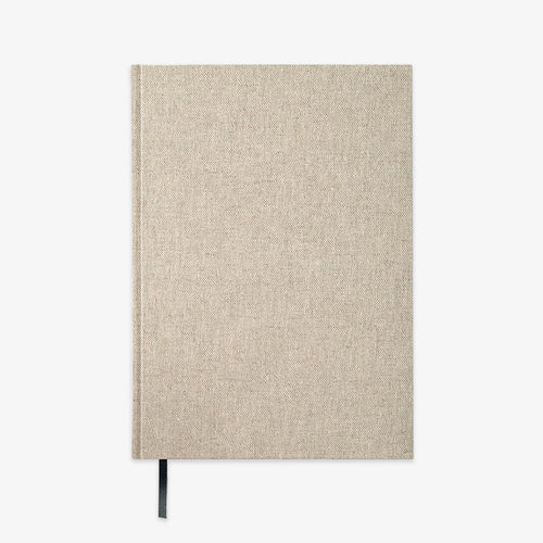 A hardcover notebook with a textured beige linen cover and a black ribbon bookmark, shown against a plain white background.