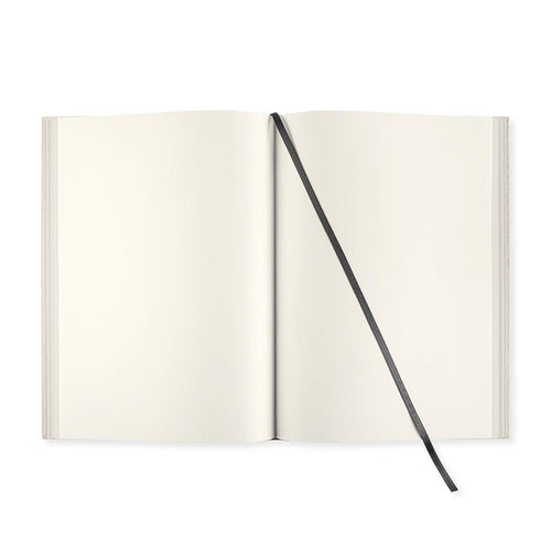 An open blank notebook with cream-colored pages and a black ribbon bookmark, shown against a solid white background.