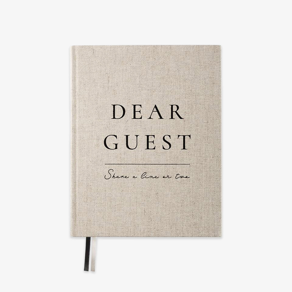 A linen-textured hardcover notebook with black printed text reading 'DEAR GUEST' and 'Share a line or two' on a clean white background.