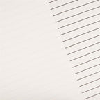White lined paper sheets with diagonal black ruled lines, filling the frame.
