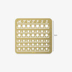Gold stencil with days of the week and geometric shapes on a white background