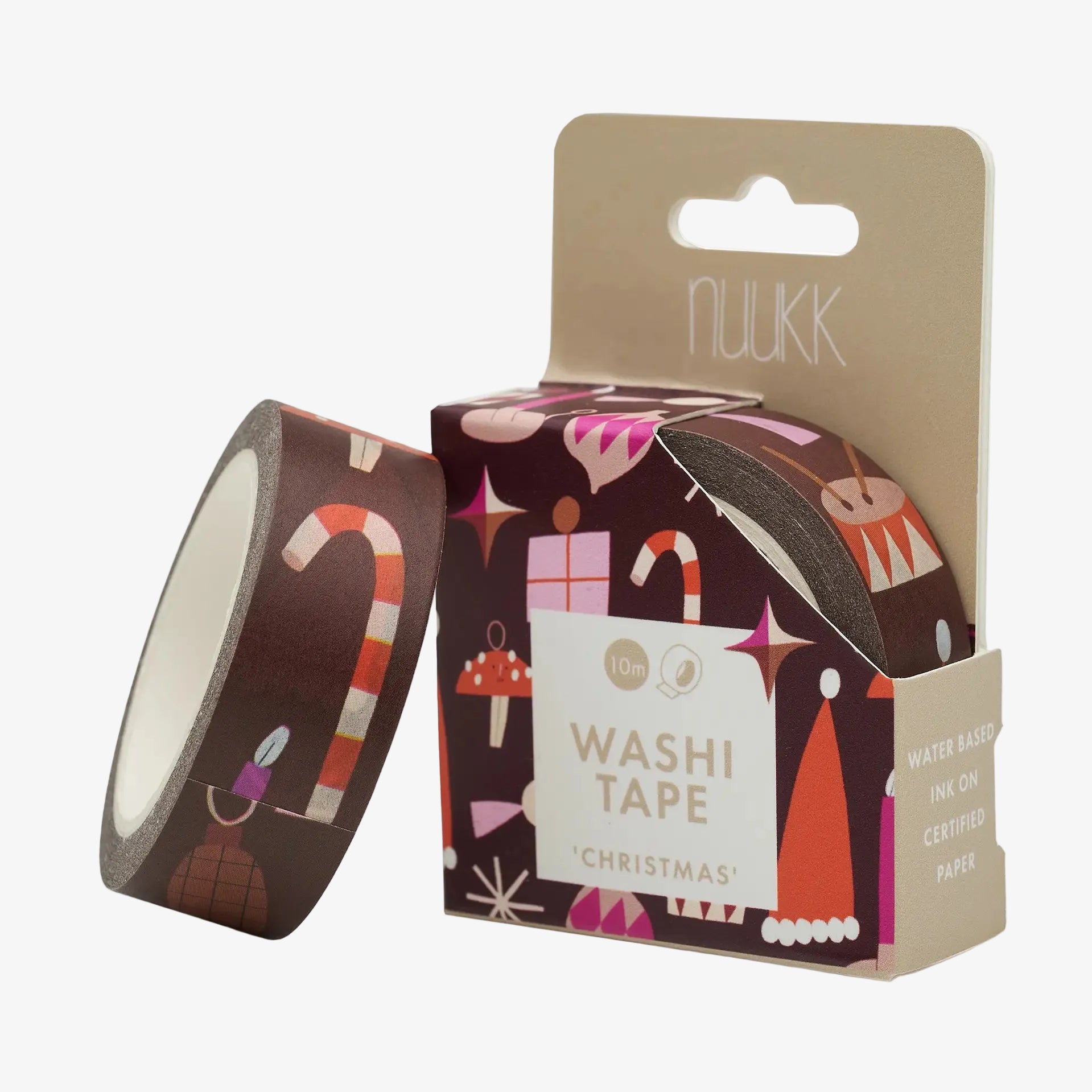 A roll of Nuukk Christmas-themed washi tape next to its cardboard packaging box, featuring festive holiday illustrations like candy canes and snowman hats on a dark brown background.