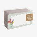 Packaged pocket notes with floral design and 'Inklings' branding on a white background