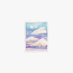 Vinyl sticker with an illustration of clouds and a moon in a pastel color palette on a white background