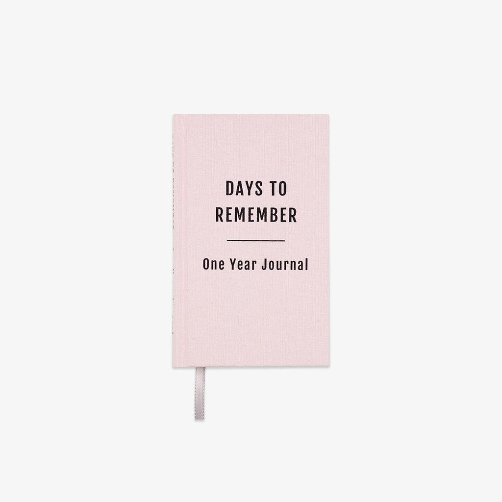Pink journal titled 'Days to Remember: One Year Journal' on a white background