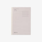 A minimalist notebook with a light gray cover, a beige vertical spine stripe, and black printed text on the top right, shown on a clean white background.