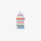 Vinyl sticker with design of a stack of books with a teacup on top against a white background