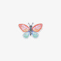 Colorful butterfly-shaped vinyl sticker with 'spread your wings' text on a white background