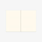 Cream-colored sheets of paper on a white background