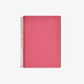Pink notebook with spiral binding on a white background