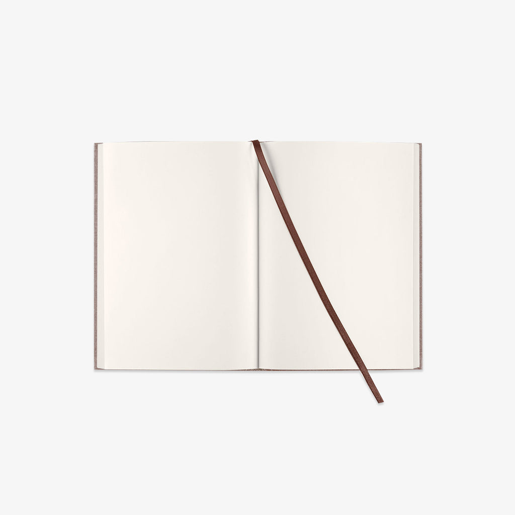 Open notebook with a brown ribbon