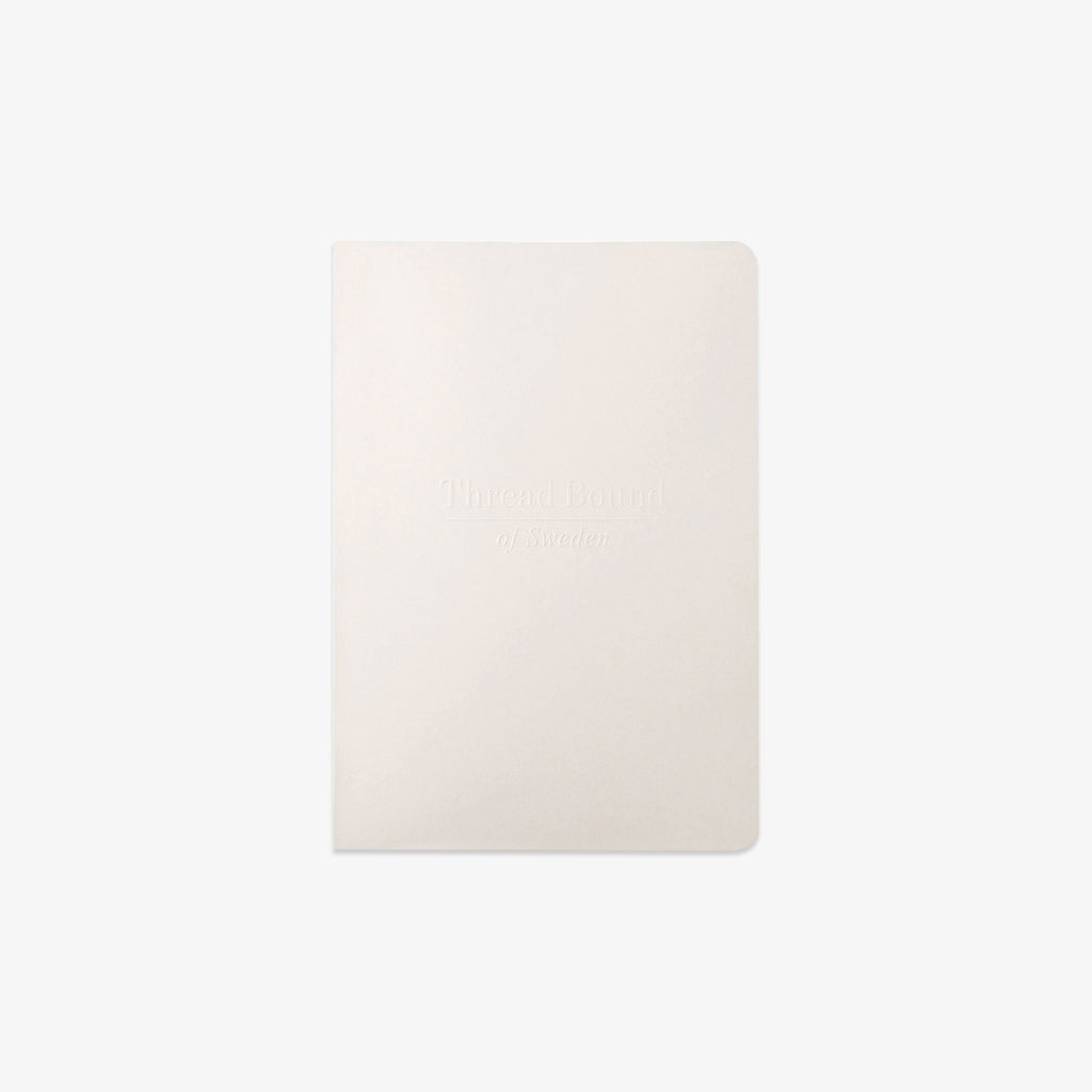 White rectangular plain and blank notebook on a white background
