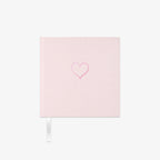 Light pink fabric Notebook with a heart design on a white background
