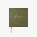 Green guestbook with gold text 'Gæstebog' on a white background