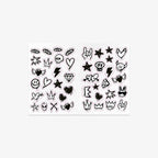 Sheet of black tattoo designs on a white background