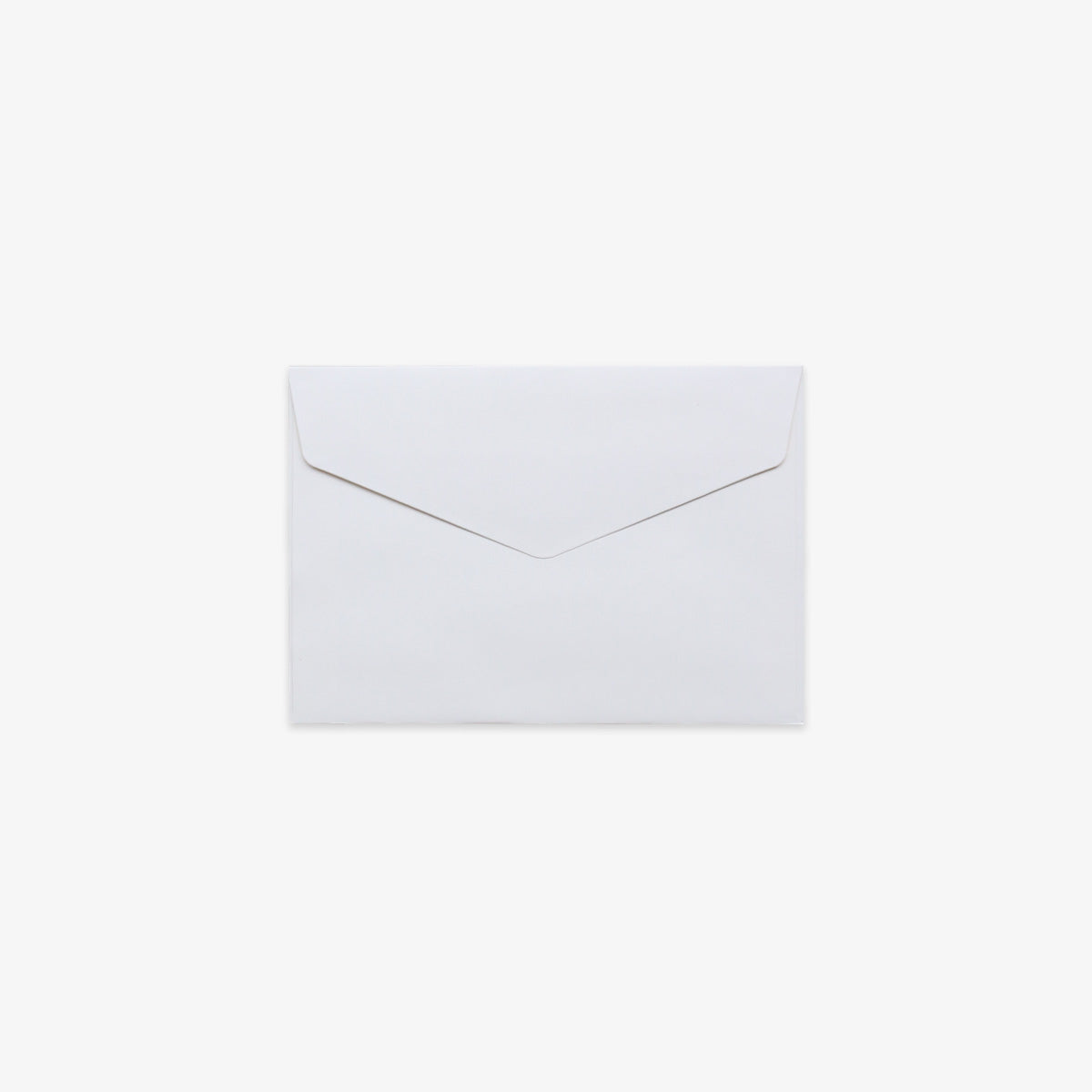 A plain white paper v-flap envelope centered on a light gray background.