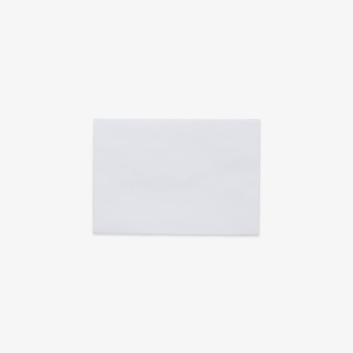 A plain white rectangular C6 envelope centered on a very light gray background.