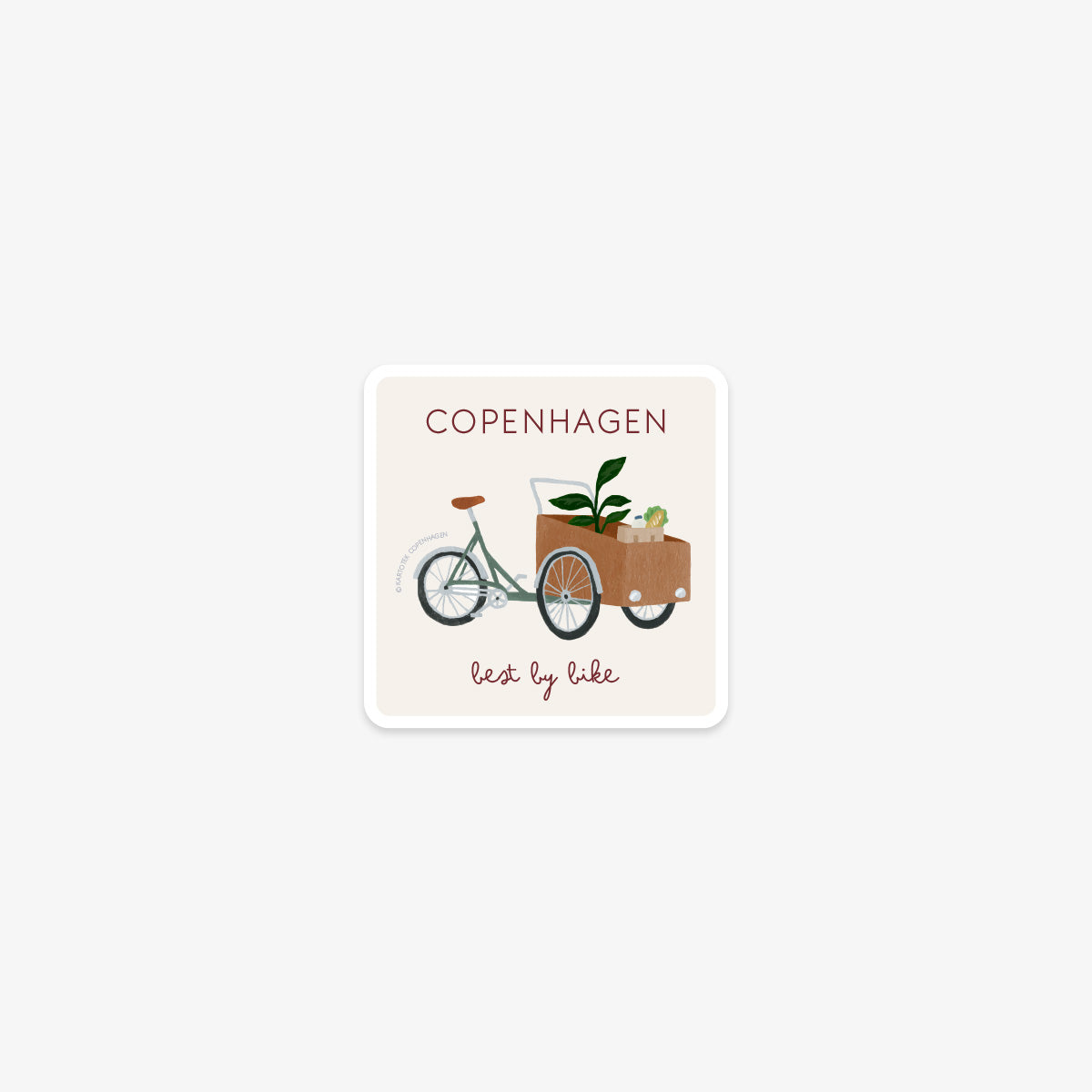Vinyl sticker with a illustration of a cargo bike and the text 'Copenhagen, best by bike' on a white background