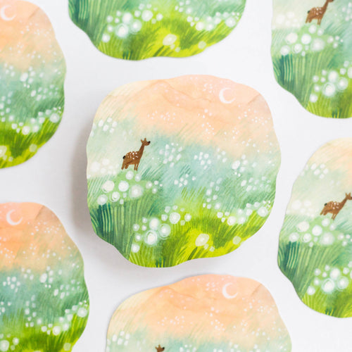 SVinyl Sickers with a nature design featuring a deer in a field on a white background.